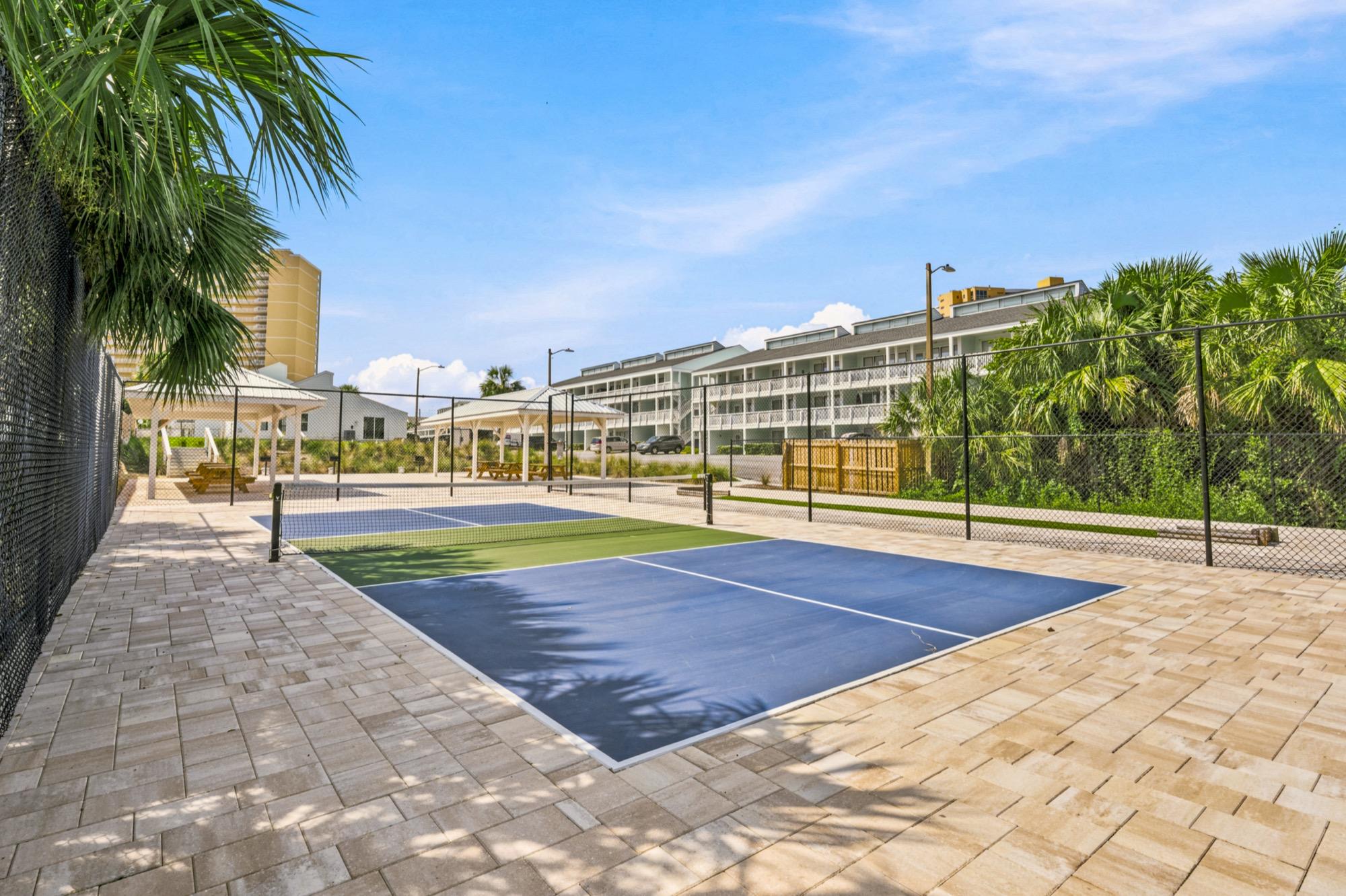 Pickleball court surrounded by palm trees at a condo community, photographed on the Florida Panhandle