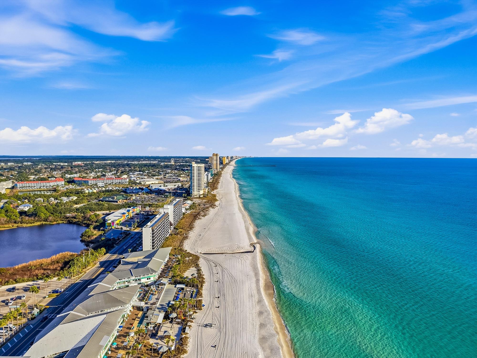 Aerial view of the shoreline, white sand beach and turquoise Gulf, photographed on the Florida Panhandle